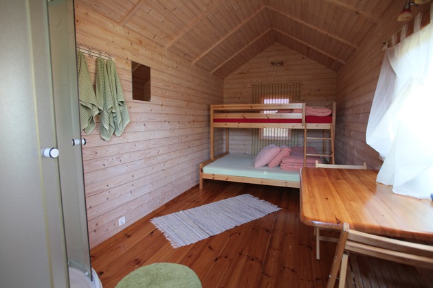 Triple cabin with shower, table, terrace.